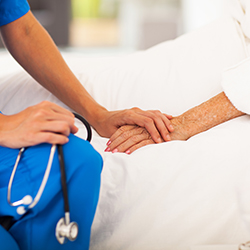 Nurse comforting patient