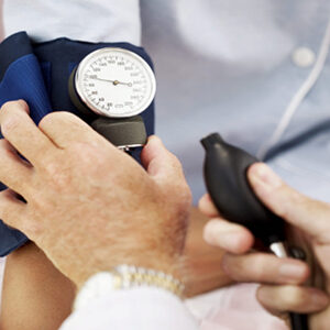 Doctor taking blood pressure with cuff